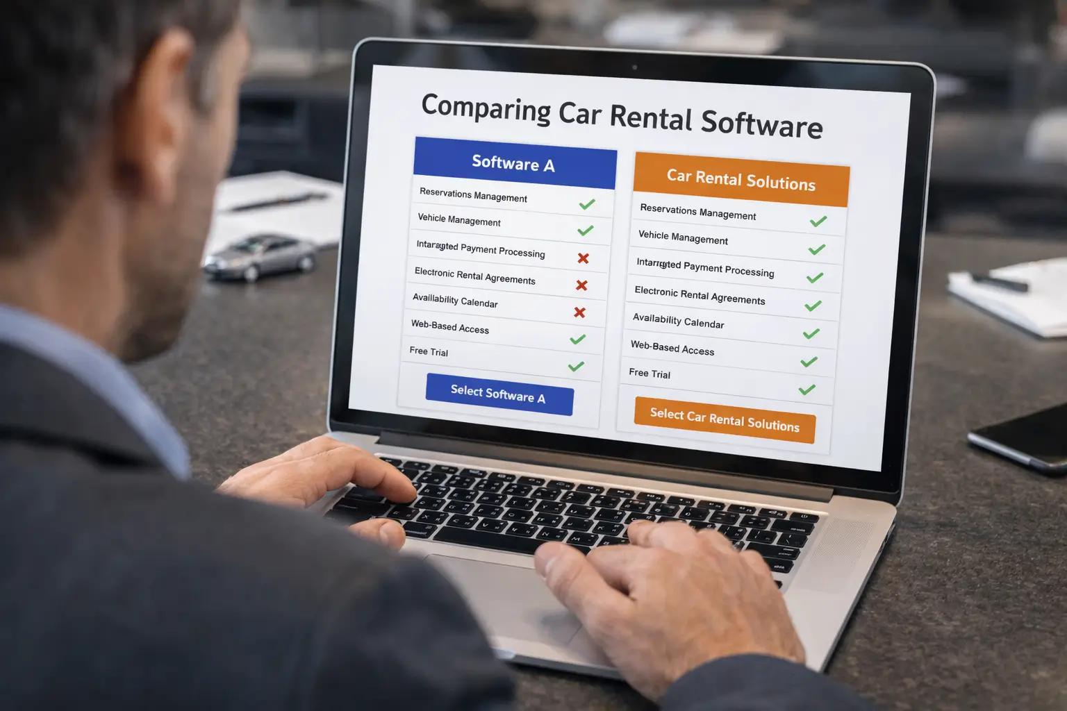 Business owner comparing car rental software on a laptop